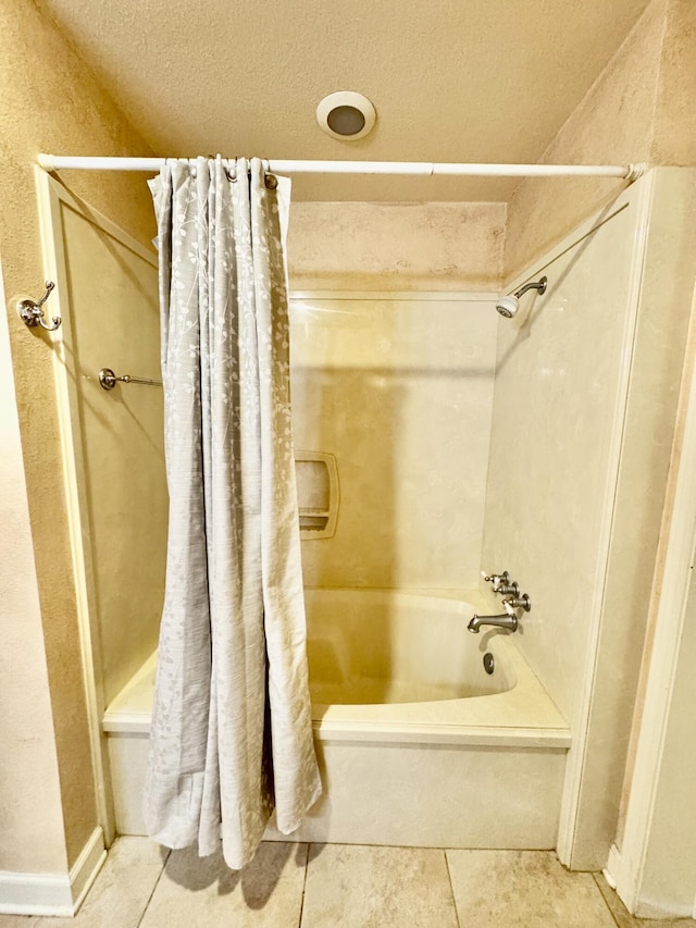 full bath featuring tile patterned flooring and shower / bathtub combination with curtain