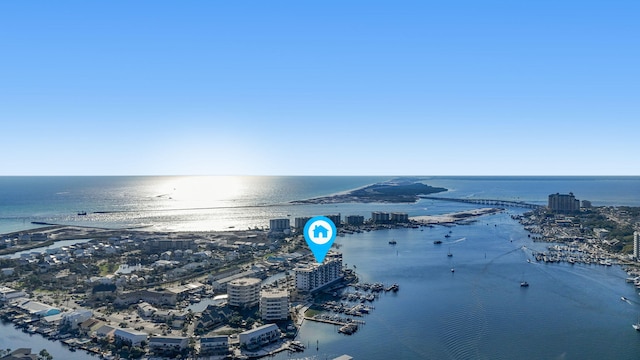 birds eye view of property with a water view and a city view