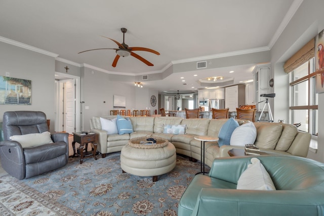 living area featuring visible vents, recessed lighting, a ceiling fan, and ornamental molding