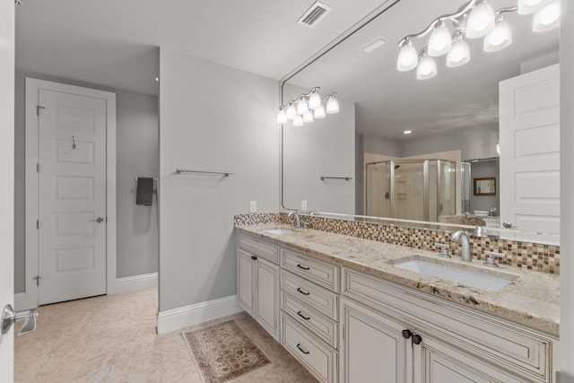 bathroom with visible vents, a sink, a shower stall, double vanity, and decorative backsplash