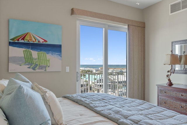 bedroom featuring visible vents and access to outside