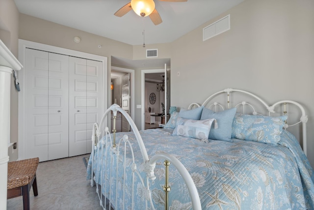 bedroom featuring visible vents, a closet, and a ceiling fan