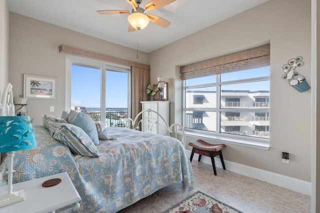 bedroom featuring a ceiling fan and baseboards