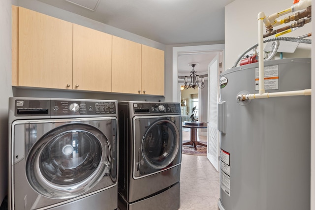 laundry area featuring light tile patterned floors, washing machine and clothes dryer, an inviting chandelier, cabinet space, and water heater