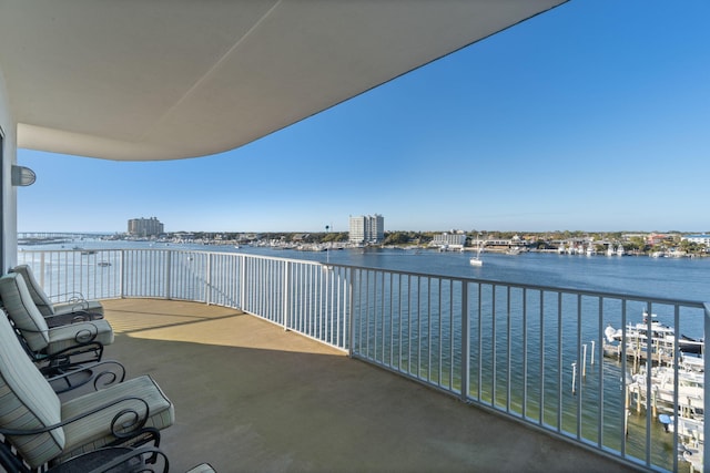 balcony featuring a water view