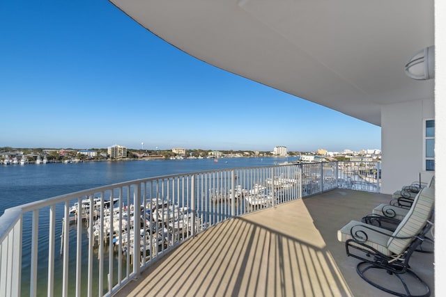 balcony featuring a water view