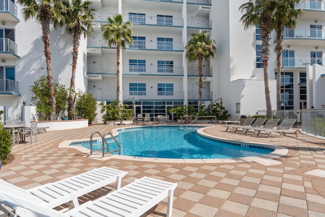 community pool with a patio