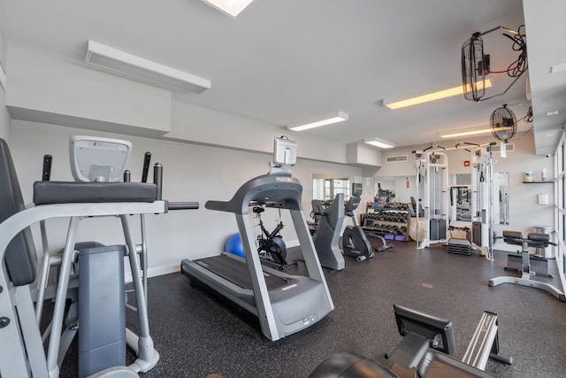 workout area with visible vents and baseboards