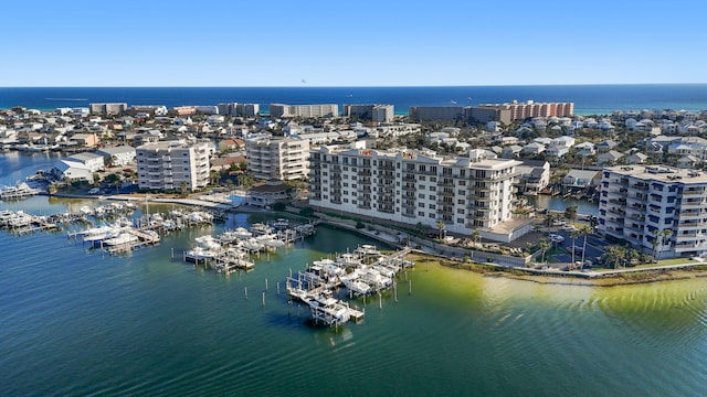 drone / aerial view featuring a water view and a view of city