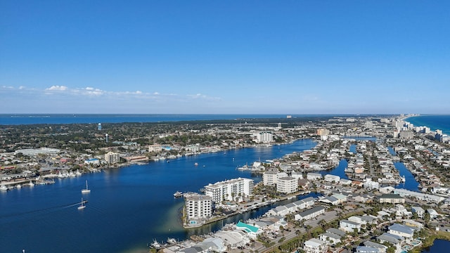 birds eye view of property with a water view and a city view