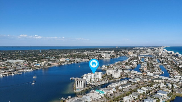 birds eye view of property featuring a city view and a water view