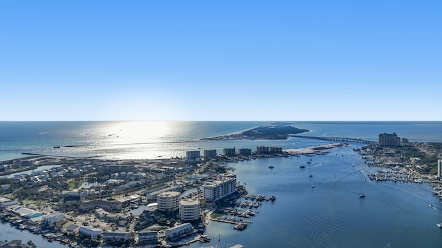 drone / aerial view featuring a view of city and a water view