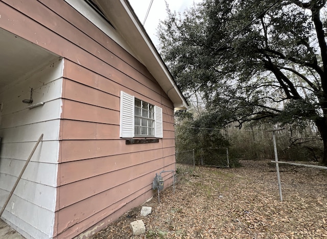 view of side of property with fence