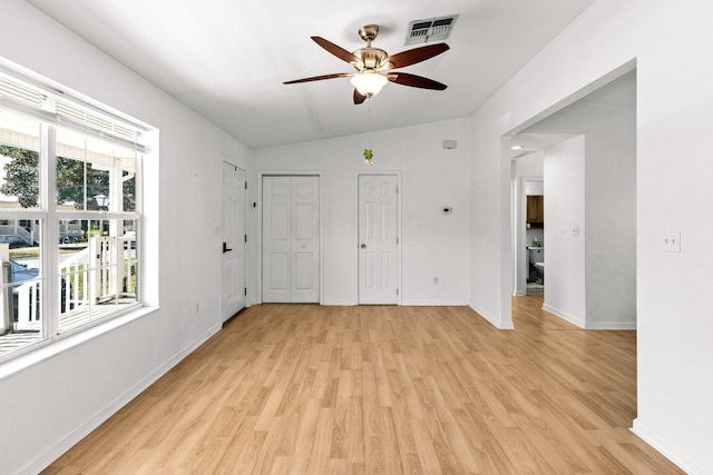 unfurnished room featuring visible vents, baseboards, light wood-style floors, and ceiling fan