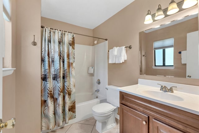 bathroom featuring tile patterned flooring, toilet, vanity, and shower / bath combo