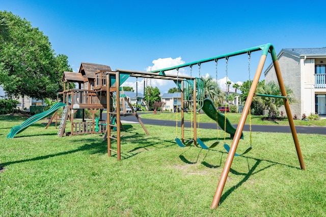 communal playground featuring a yard