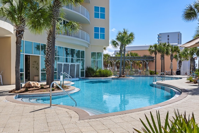 pool featuring a patio area and a pergola