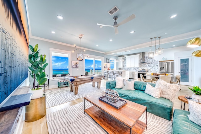 living room featuring visible vents, ceiling fan, pool table, and ornamental molding