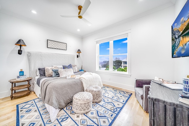 bedroom with crown molding, recessed lighting, wood finished floors, and baseboards