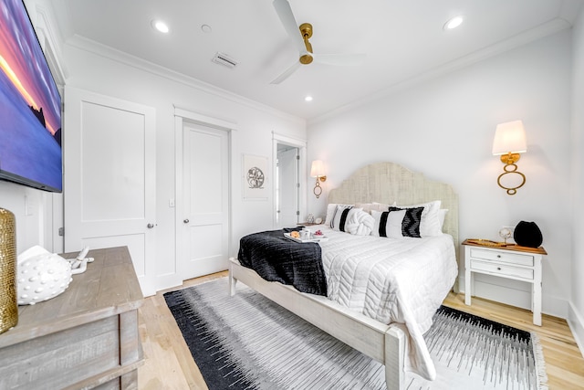 bedroom with crown molding, recessed lighting, light wood-type flooring, and visible vents