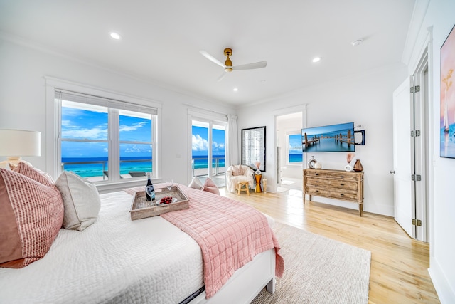 bedroom with recessed lighting, light wood-style floors, access to exterior, and crown molding