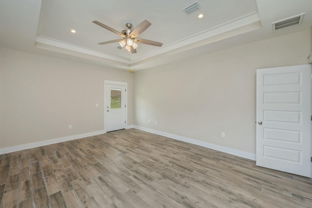 1517 Kais St, Baker, FL 32531 - unfurnished room with ceiling fan, wood finished floors, a tray ceiling, and visible vents