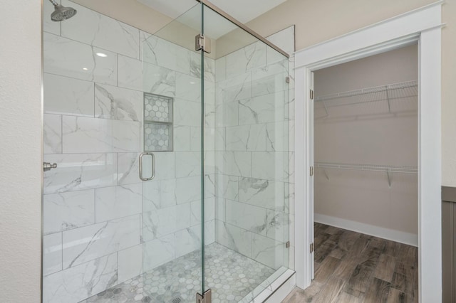1517 Kais St, Baker, FL 32531 - full bath with wood finished floors, a spacious closet, and a stall shower