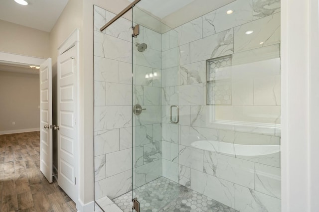 1517 Kais St, Baker, FL 32531 - bathroom with baseboards, recessed lighting, wood finished floors, and a stall shower