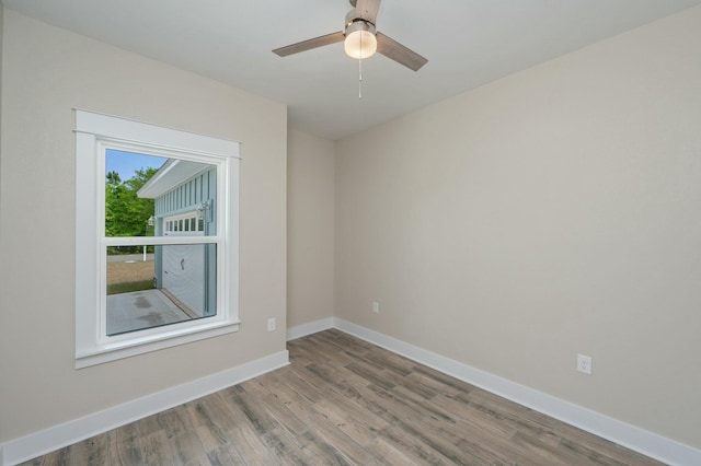 1517 Kais St, Baker, FL 32531 - empty room featuring baseboards, a ceiling fan, and wood finished floors