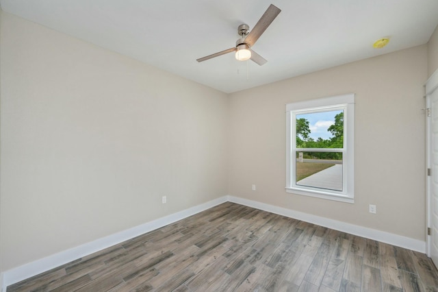 1517 Kais St, Baker, FL 32531 - spare room with baseboards, a ceiling fan, and wood finished floors