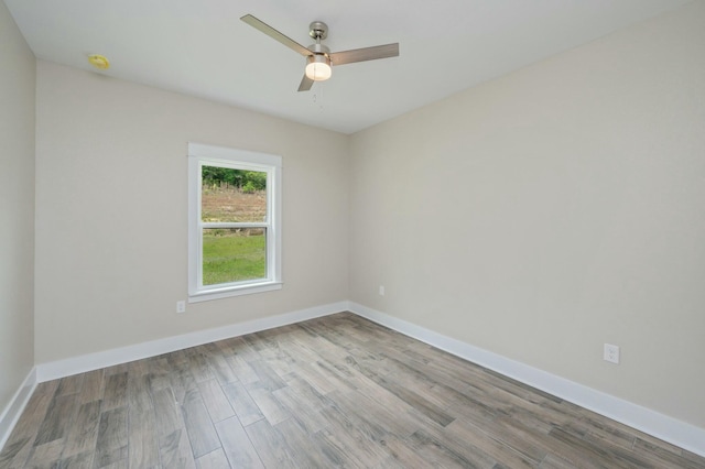 1517 Kais St, Baker, FL 32531 - empty room with wood finished floors, baseboards, and ceiling fan