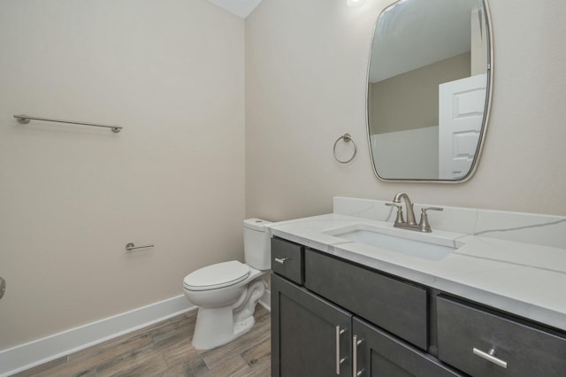1517 Kais St, Baker, FL 32531 - half bathroom featuring baseboards, toilet, vanity, and wood finished floors