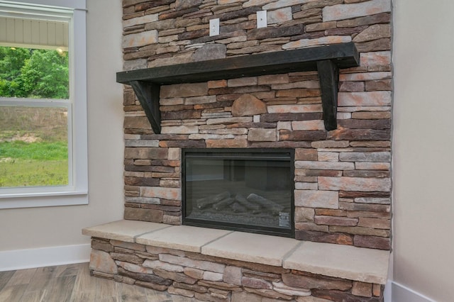 1517 Kais St, Baker, FL 32531 - details with a fireplace, wood finished floors, and baseboards