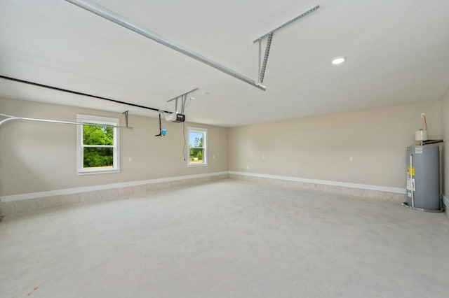 1517 Kais St, Baker, FL 32531 - garage with a garage door opener, gas water heater, and baseboards