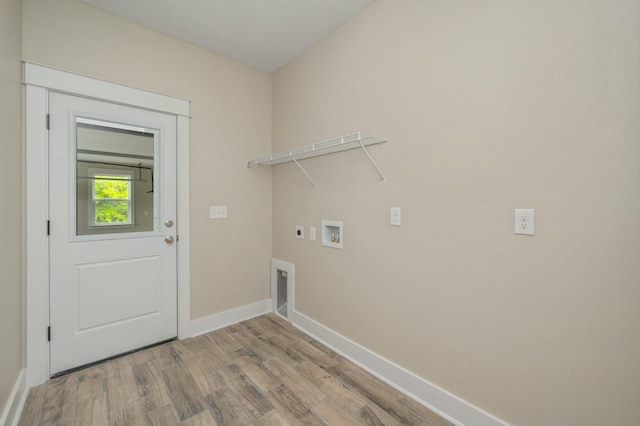 1517 Kais St, Baker, FL 32531 - laundry area featuring hookup for an electric dryer, light wood-type flooring, baseboards, washer hookup, and laundry area