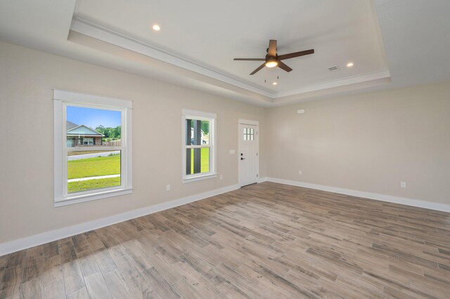 5390 Aidan St, Baker, FL 32531 - spare room with a tray ceiling, ceiling fan, ornamental molding, wood finished floors, and baseboards
