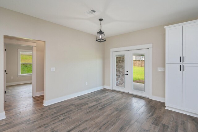 5390 Aidan St, Baker, FL 32531 - unfurnished dining area with french doors, dark wood-style flooring, plenty of natural light, and baseboards