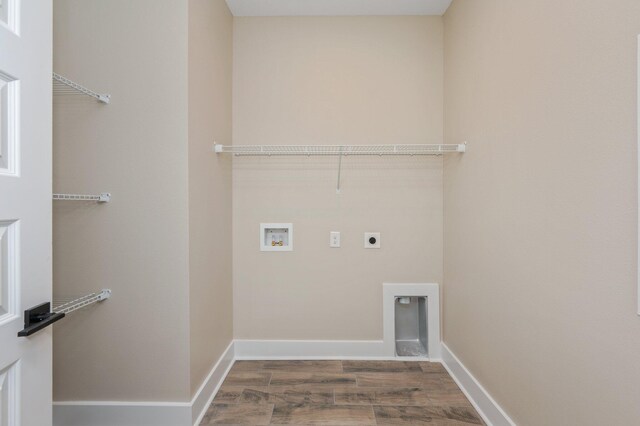 5390 Aidan St, Baker, FL 32531 - clothes washing area featuring hookup for an electric dryer, hookup for a washing machine, wood finished floors, and baseboards