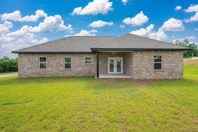5390 Aidan St, Baker, FL 32531 - rear view of house with french doors, brick siding, a lawn, and a shingled roof
