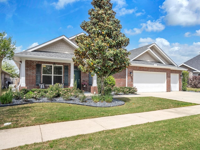 view of front of property with brick siding, a front lawn, a garage, and concrete driveway