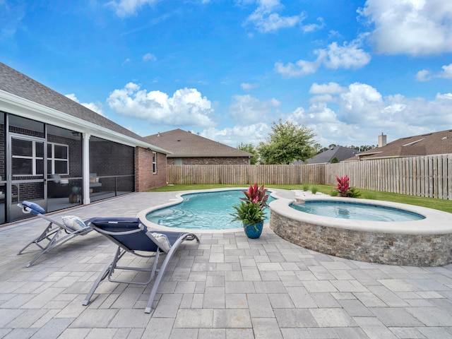 view of pool with a fenced in pool, a patio, an in ground hot tub, a fenced backyard, and a sunroom