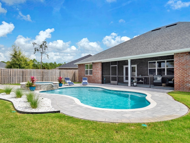 view of pool with a patio, a fenced backyard, a sunroom, and a yard