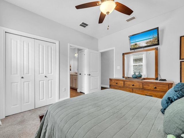 bedroom with visible vents, ceiling fan, a closet, and ensuite bathroom