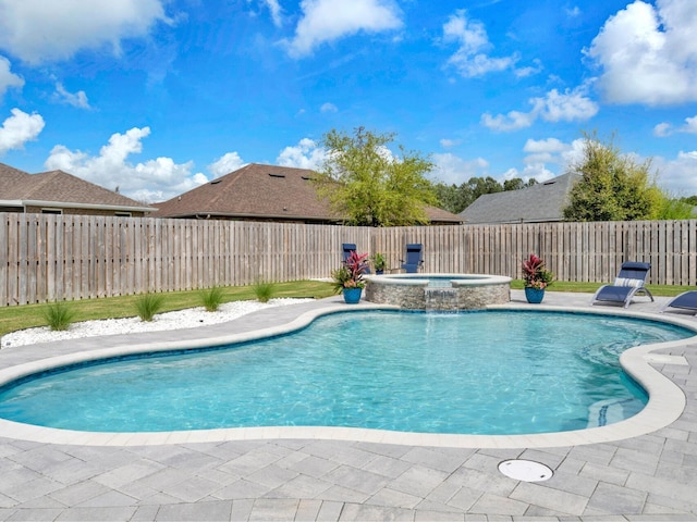 view of swimming pool with a patio area, a fenced backyard, and a pool with connected hot tub
