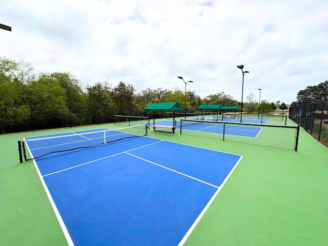 view of tennis court with fence