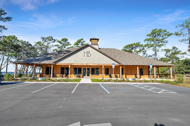 view of property featuring uncovered parking