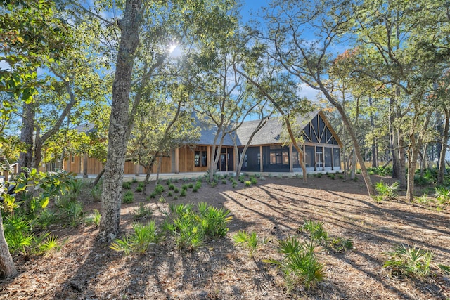 back of house featuring a sunroom