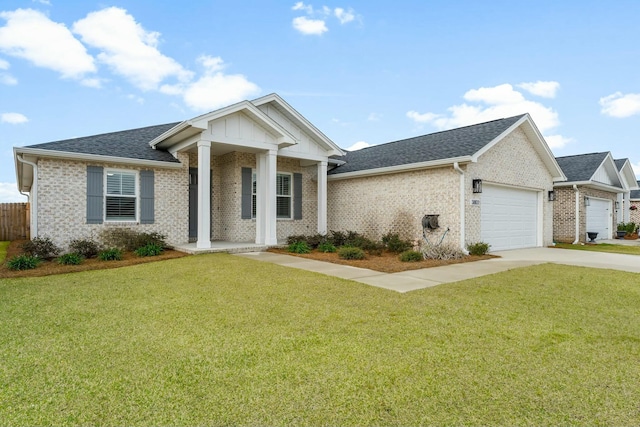 view of front facade featuring brick siding, a garage, concrete driveway, and a front lawn