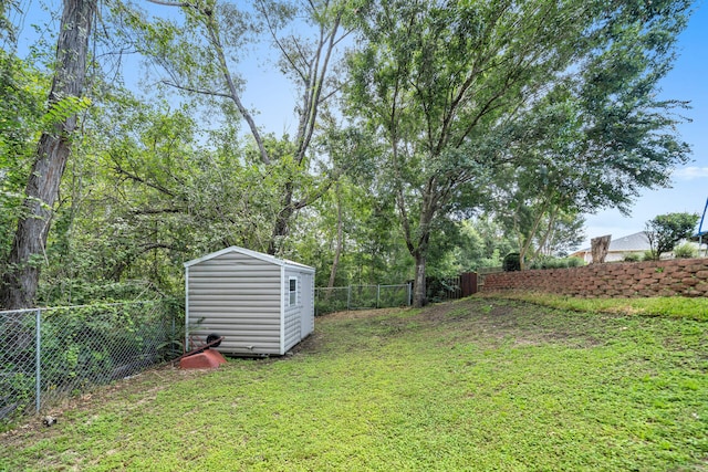 318 Peggy Dr, Crestview, FL 32536 - view of yard with a fenced backyard, a shed, and an outdoor structure