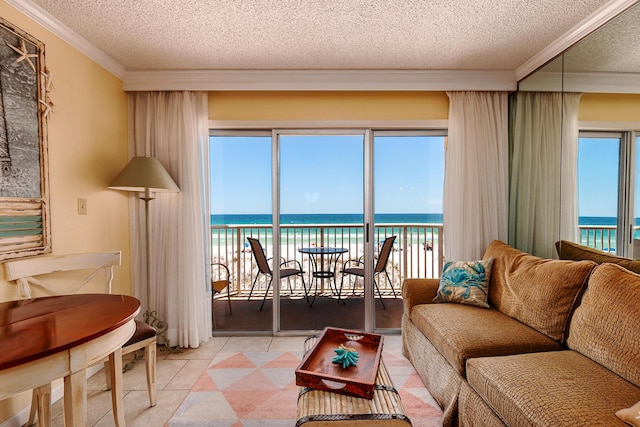 790 Santa Rosa Blvd Unit 304, Fort Walton Beach, FL 32548 - living area with light tile patterned flooring, ornamental molding, a water view, and a textured ceiling